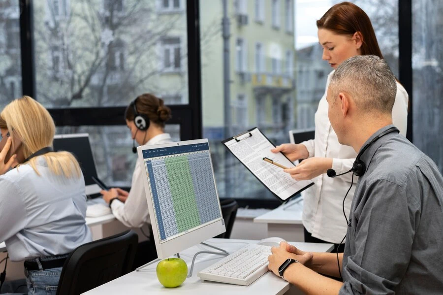 team managing leads for plumbing business in an office